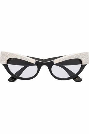 Gucci Lentes de sol con armazón cat eye y detalles de cristal