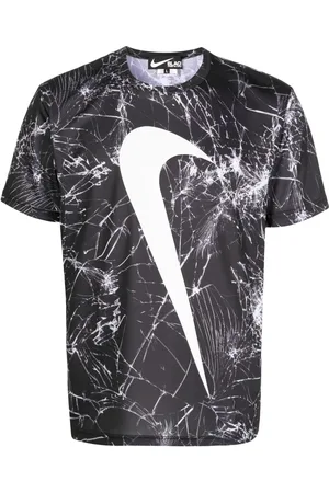 Comme des Garçons Playera con estampado Swoosh