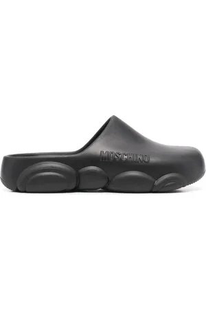 Moschino Mules con logo en relieve