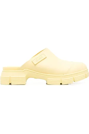 Ganni Mules City con suela gruesa