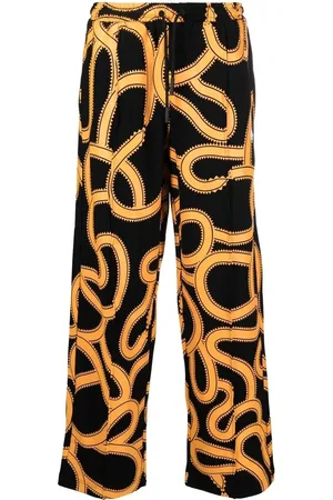 MARCELO BURLON Pants con motivo Snake