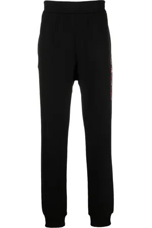 VERSACE Pants con logo estampado