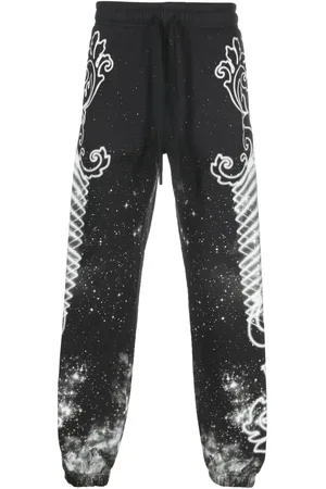 VERSACE Pants con galaxia estampada