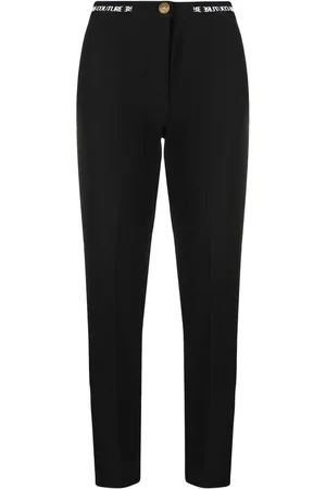 VERSACE Pantalones de vestir con logo en la pretina