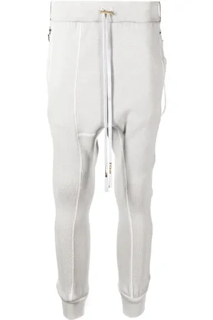 11 BY BORIS BIDJAN SABERI Pants drop crotch con detalle de parche