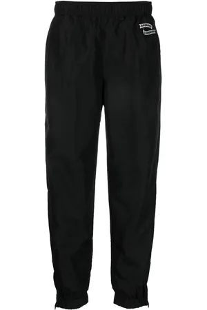 Opening Ceremony Pants con parche del logo