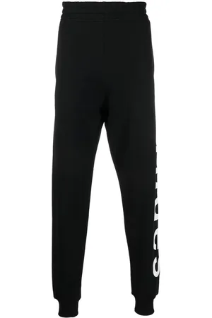 Etudes Pants con logo en la pierna