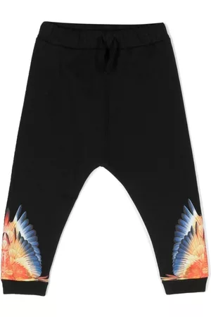 MARCELO BURLON Pants con estampado Wing