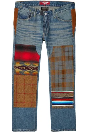 JUNYA WATANABE Jeans con tiro medio y diseño patchwork