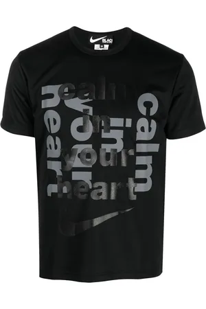 Comme des Garçons Playera con motivo Swoosh