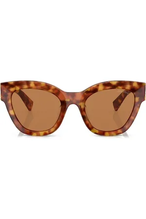 Miu Miu Lentes de sol con armazón cat eye estilo carey