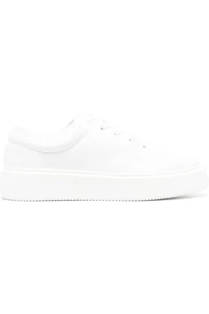 Ganni Tenis bajos con parche del logo