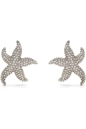 Amina Muaddi Aretes Astra en forma de estrella con apliques de cristal