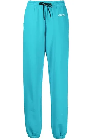VERSACE Pants con logo estampado
