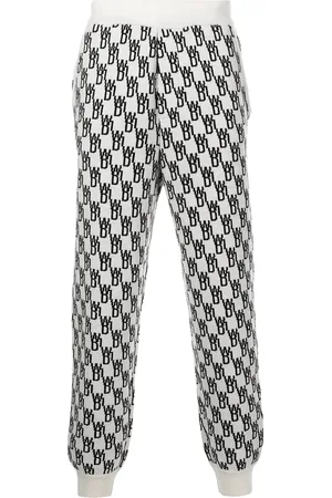 We11 Done Pants con motivo del monograma