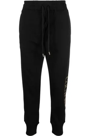 VERSACE Pants con logo metalizado