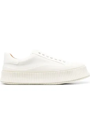 Jil Sander Tenis bajos con agujetas y suela dentada