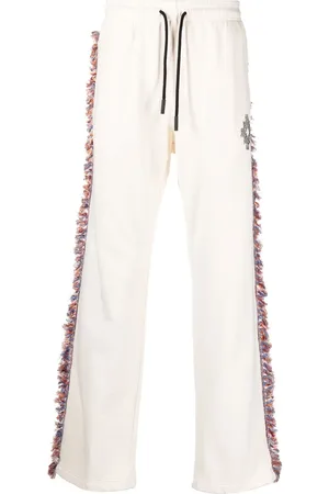 MARCELO BURLON Pants con flecos