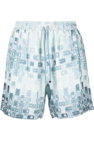 AMIRI Shorts de seda con logo estampado