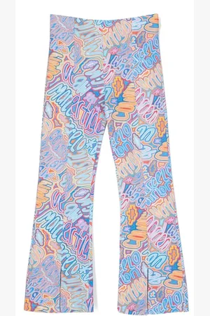 MARCELO BURLON Pantalones con logo estampado