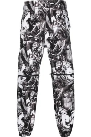 UNDERCOVER Pants con estampado gráfico