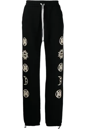 AMIRI Pantalones con estampado gráfico