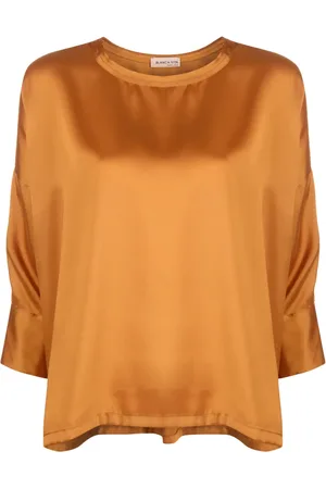BLANCA Blusa asimétrica con acabado satinado