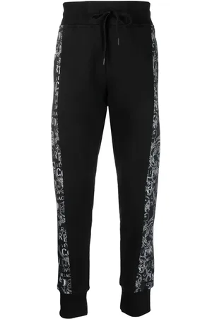 VERSACE Pants con logo Couture