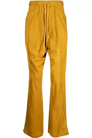 Pantalones acampanados de color amarillo para hombre