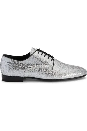 Giuseppe Zanotti Mocasines metalizados con agujetas
