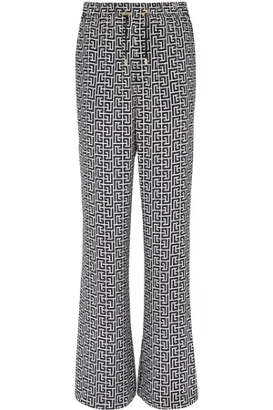 Balmain Pantalones anchos con monograma estampado