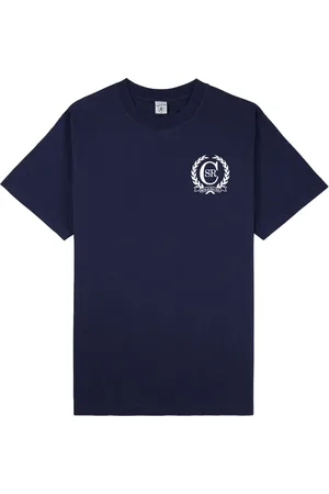 Sporty & Rich Playera con motivo de insignia