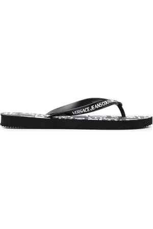 VERSACE Hombre Flip flops - Flip-flops con logo en relieve