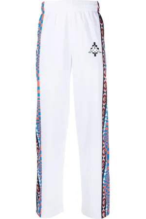 MARCELO BURLON Pants con logo estampado