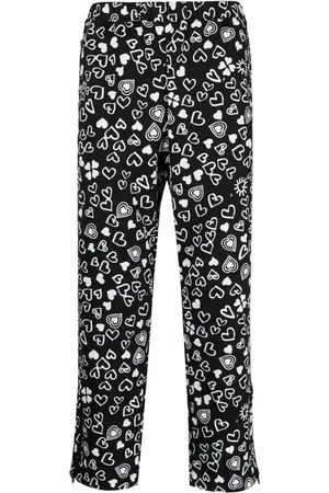 Comme des Garçons Pantalones cortos con corazones estampados