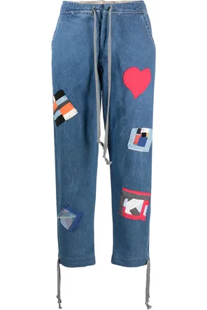 GREG LAUREN Jeans con cordones y detalle de parche