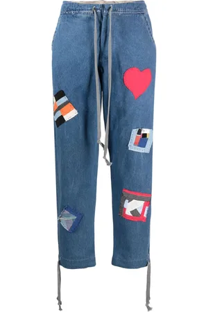 GREG LAUREN Jeans con cordones y detalle de parche