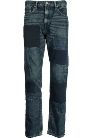 NEIGHBORHOOD Jeans de mezclilla con detalle de parche