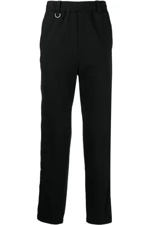 UNDERCOVER Pantalones rectos con parche del logo