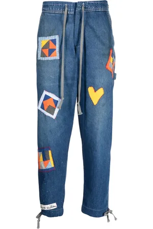 GREG LAUREN Jeans con cordones y detalle de parche
