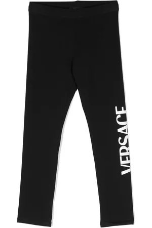VERSACE Pantalones - Leggins con logo estampado