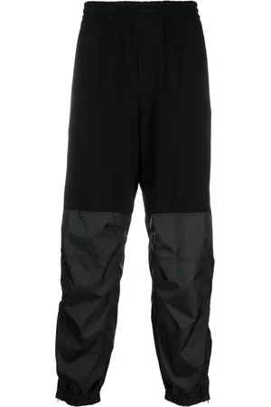UNDERCOVER Pants con paneles y pretina elástica