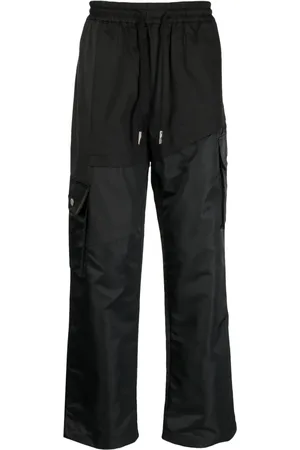 Feng Chen Wang Pantalones anchos con cordones en la pretina y paneles