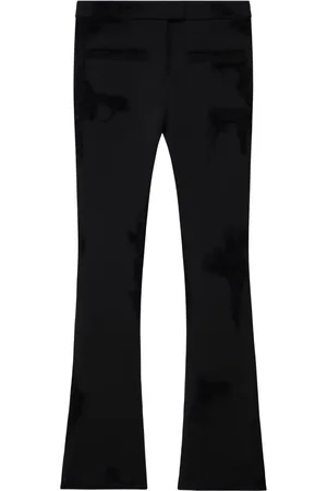 Courrèges Pantalones acampanados con efecto envejecido