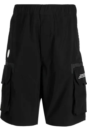 A Bathing Ape Shorts deportivos con texto estampado