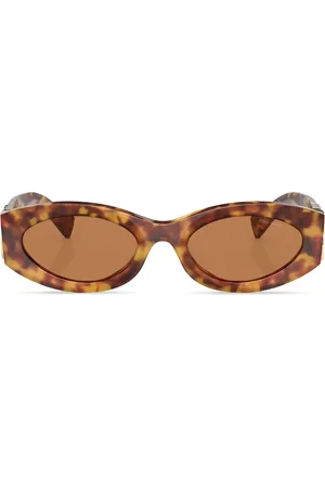 Miu Miu Lentes de sol con armazón cat eye estilo carey