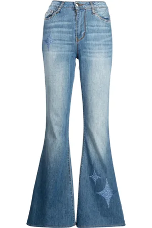 Madison.Maison Jeans acampanados con tiro alto y estrellas estampadas
