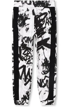 DKNY Pantalones con franjas del logo y estampado de grafiti