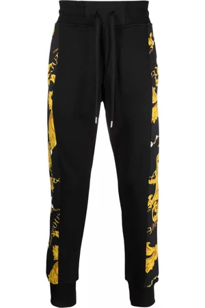 VERSACE Pantalones con estampado Barocco
