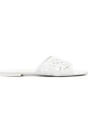 Tory Burch Mules con cortes a láser